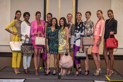 Tammi DeFrancisco (COG President)and Gina Conti (winner of a designer handbag courtesy of The Colonnade Outlets at Sawgrass Mills) with event models