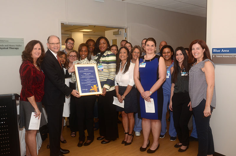 The inpatient rehabilitation team with Holy Cross Hospital President and CEO Dr. Patrick Taylor (second from the left) during the grand opening celebration of the hospital’s new Linda and Henry Haller Physical Therapy Center. 