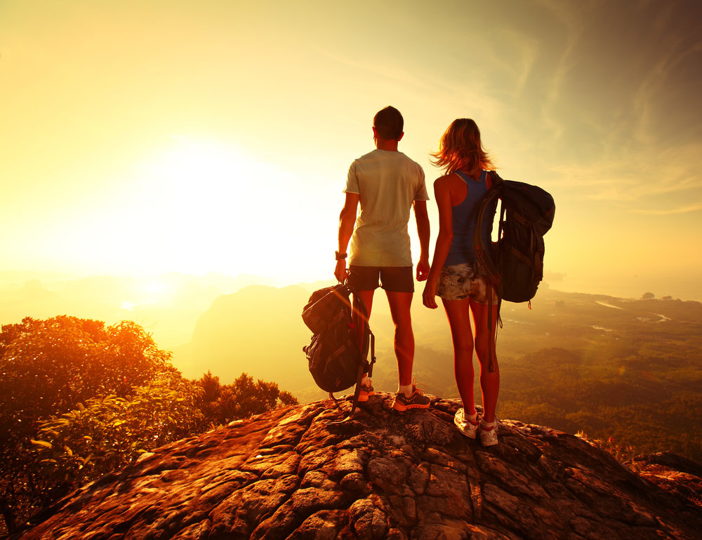 Man and Woman looking at a sunrise