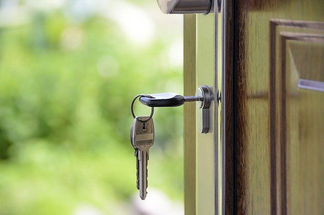 A key inserted in a house door  keyhole