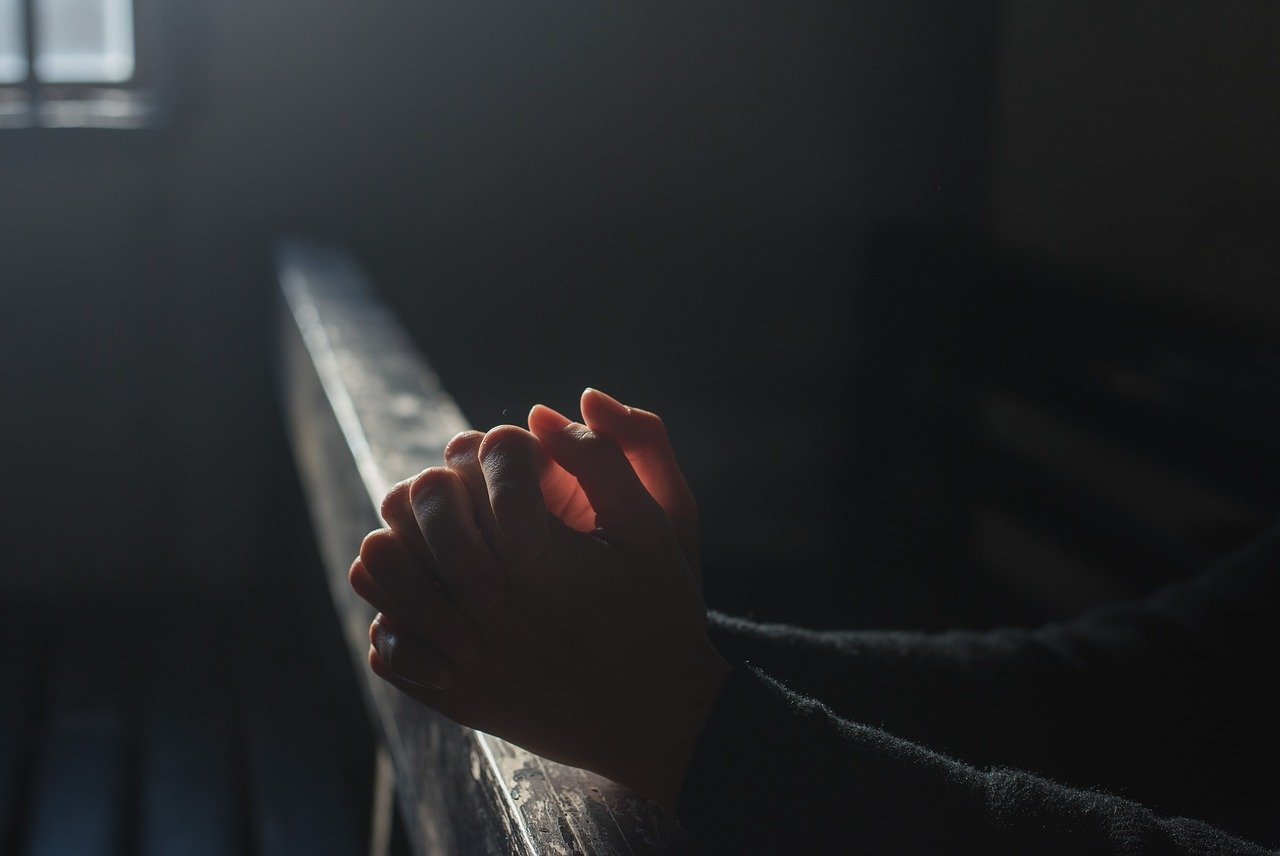 A man praying at church