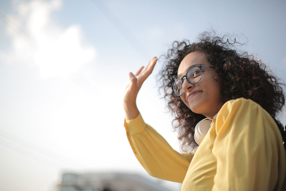 A girl waving, symbolizing best places to meet new people in Fort Lauderdale