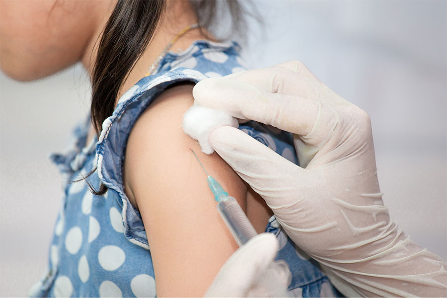 A girl receiving a vaccine