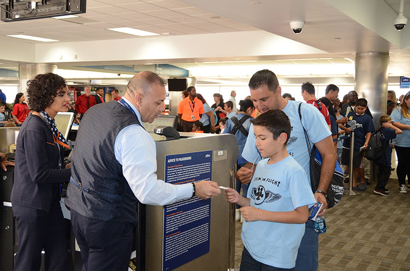 Students prepare to board Autism in Flight.