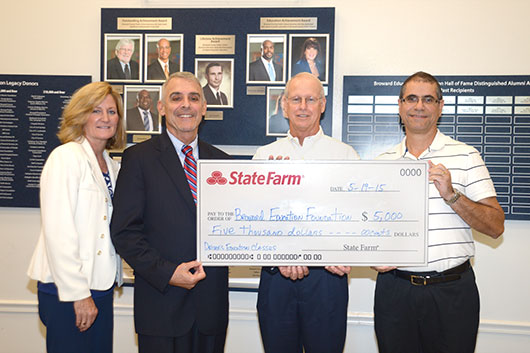 (l to r) Coco Burns, Broward Education Foundation; Thomas Severino, president and CEO of Broward Education Foundation; Chuck Forum , State Farm Agent;  Jose Soto, Community Specialist, State Farm Insurance.